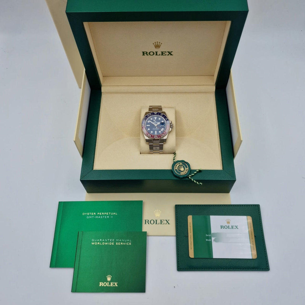 Rolex GMT-Master II "Pepsi" Automatik Herrenuhr Weißgold 40mm STICKERED 116719BLRO - Papiere und oder Lieferumfang
