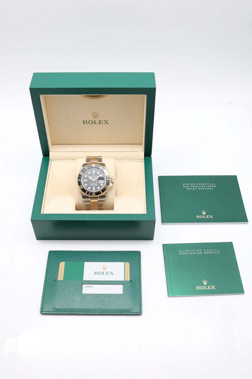 Rolex Sea-Dweller Stahl/Gold Automatik Schwarz Teilverklebt 126603 - Papiere und oder Lieferumfang