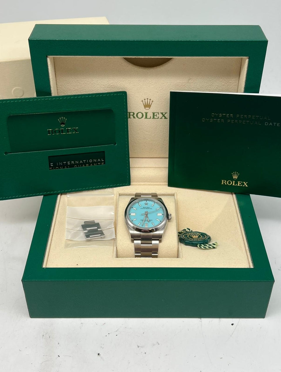 Rolex Oyster Perpetual "Tiffany" 36mm Automatik 126000 - Papers and documentation