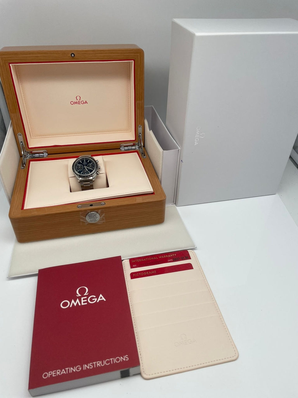 Omega Speedmaster Racing Automatik Herrenuhr Blau 32630405003001 - Papiere und oder Lieferumfang