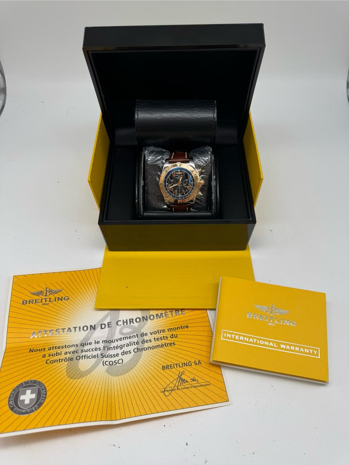 Breitling Chronomat 44 Stahl/Gold Automatik Herrenuhr	 CB0110 Box + og. Papiere