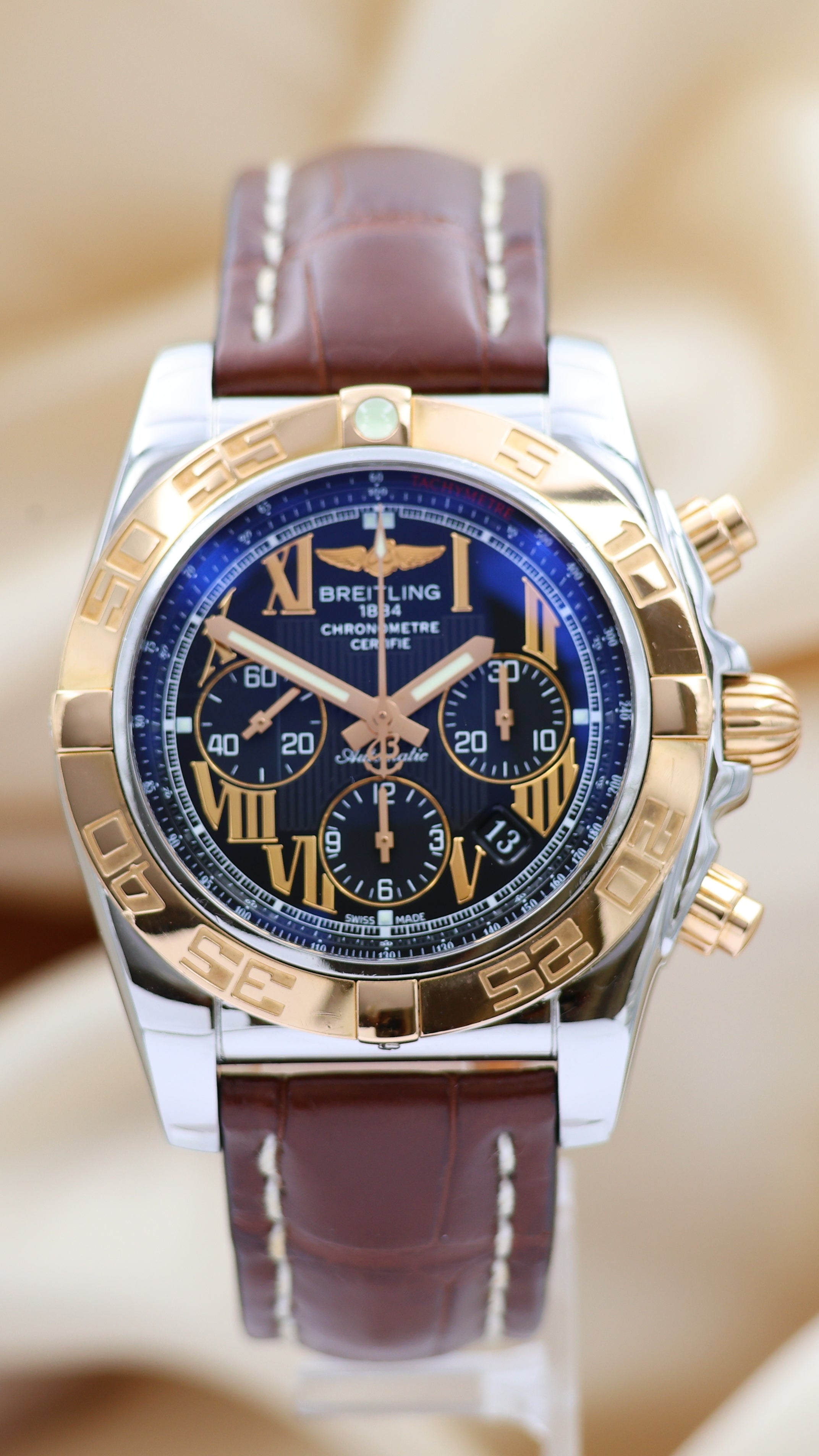 Breitling Chronomat 44 Stahl/Gold Automatik Herrenuhr	 CB0110 Box + og. Papiere